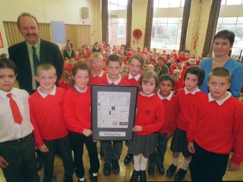 English Martyrs RC Primary School headteacher Adrian Dunn and pupils receive their Child Safety Week poster from Jane Martin from the Lancashire Evening Post