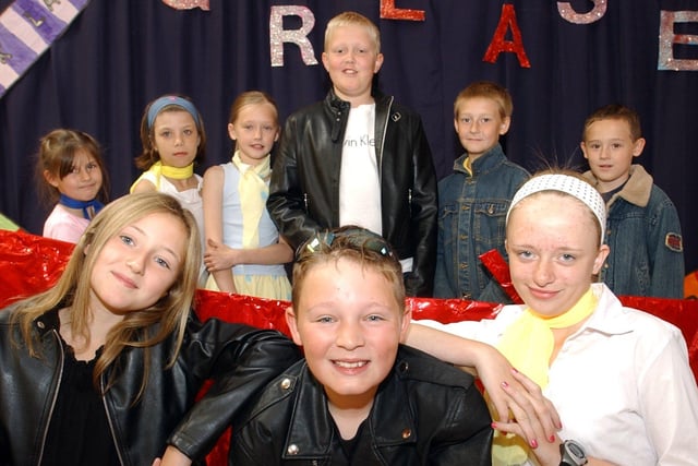 From left, Amy Kinlock, Christpher Lock and Chloe Lang and fellow performers from St James CE Primary, Chorley, taking part in Grease