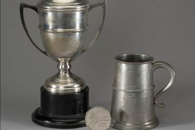 A cup, a tankard and a medal from McMahon's two promotion campaigns with North End (Image: Graham Budd Auctions).