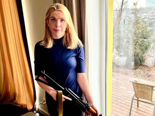Ukrainian MP Kira Rudik holding the weapon she says she will use to help defend her country against the Russian invasion