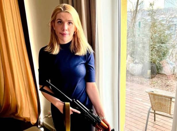 Ukrainian MP Kira Rudik holding the weapon she says she will use to help defend her country against the Russian invasion