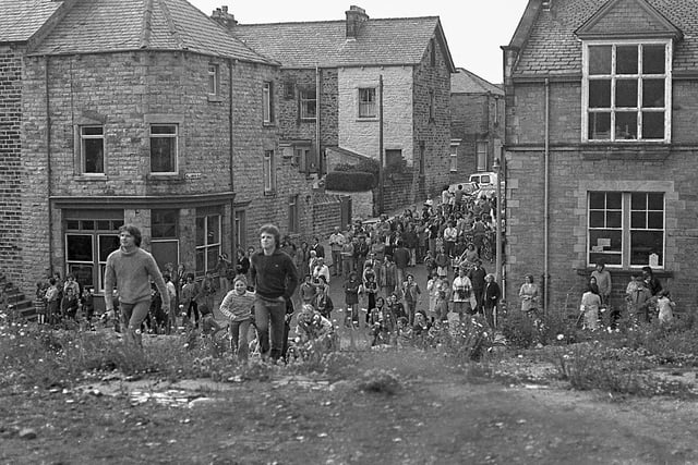 People at the scene of the chimney being taken down in Lancaster in the mid 1970s. Picture courtesy of Keith Taylor.