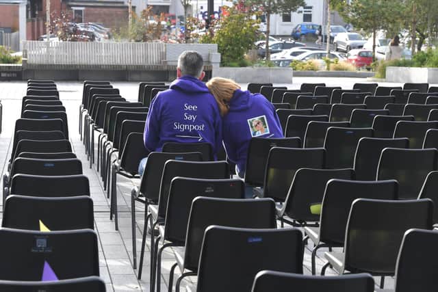 Sharon and Paul, parents of Mary O'Gara in the empty chairs outside UCLan