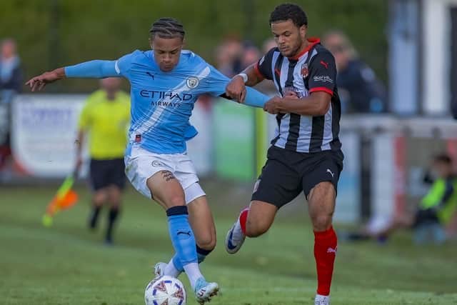 Chorley's Craig Hewitt, right, in action against Manchester City in the club's final pre-season friendly (photo: David Airey/dia_images)