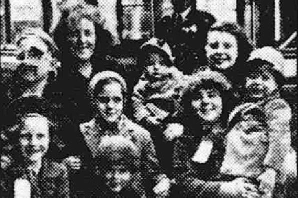 Mrs G Evans, of Harrow, and her family of eight children at Preston railway station in June 1945 preparing to head home to London after being billeted in Preston as evacuees following the Second World War bombing of London