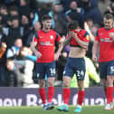 Preston North End players look dejected after their side concede at Derby County.