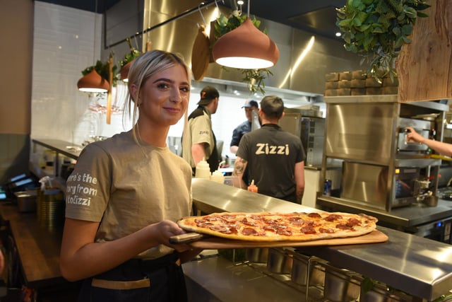 A pizza being served at Zizzi.