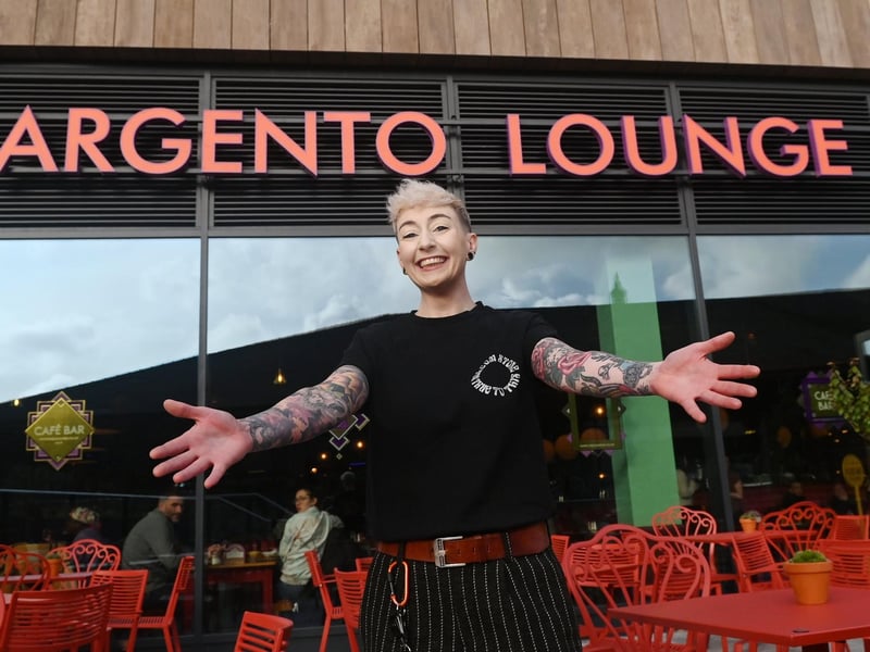 General manager Heather McNulty gets ready to welcome customers at the opening of Argento Lounge, bar and restaurant.