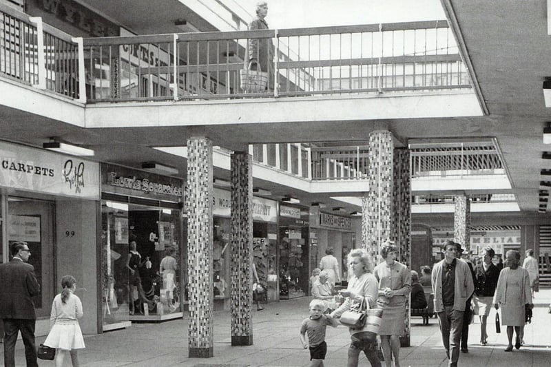 A crowd of over 40,000 attended the opening on the new St George’s Shopping Centre in Preston in 1969.  It was originally planned and built as an open air facility but was later fully enclosed. Some of the shops seen in this image are: Cyril lord (carpets) Lewis Separates, Marks & Spencers, Dawes, Melias, Curtis Shoes and Wyles. Picture courtesy of Preston Digital Archive. 
