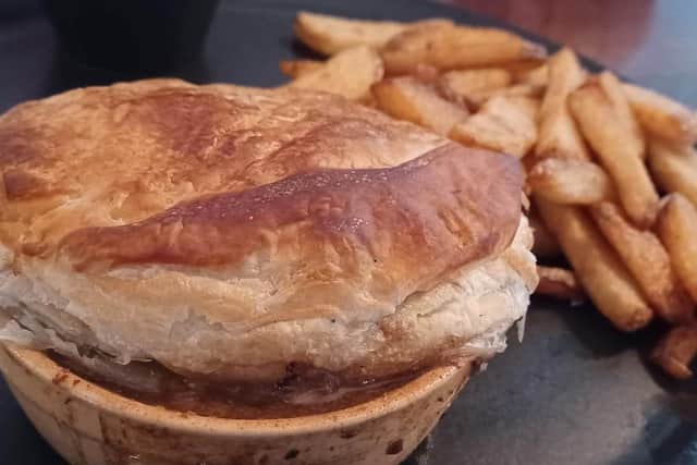 Steak and Ale Pie - slow cooked grass fed beef, gravy with home cut chips and mushy peas £13.95