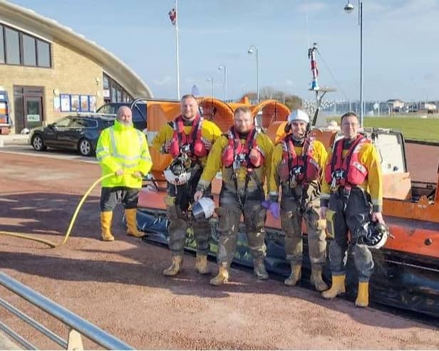 Morecambe RNLI crews with the hovercraft after the rescue from quicksand near Silverdale. Picture from RNLI.