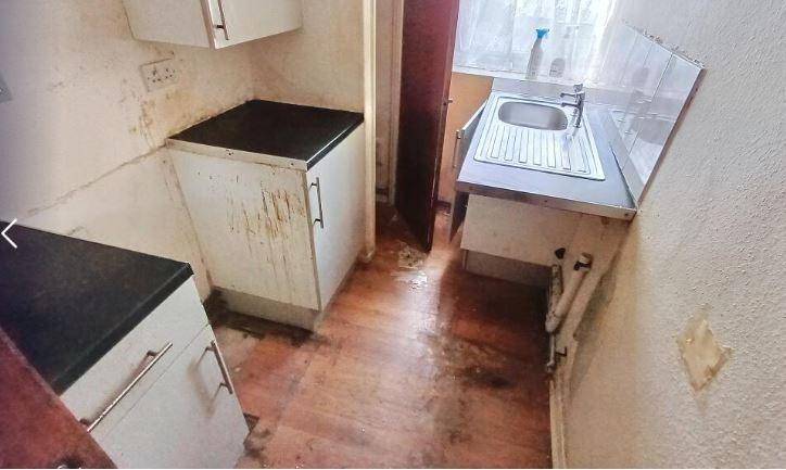 This one bedroom flat is being offered at auction for a guide price of £10,000.
It's described as a "larger-than-average one-bedroom ground floor apartment with designated parking space" and although it needs some TLC, can achieve rental in the region of approximately £6,000 per annum.