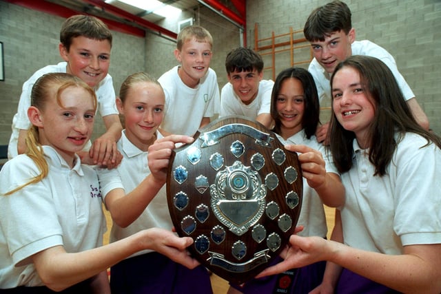 Year captains from All Hallows RC High School in Penwortham, near Preston, hold onto the South Ribble and District Athletics Championship Trophy which the school won at Stanley Park in Blackpool. Front row (from left): Susan Ormerod, 12, Rachel Lockley, 13, Fiona McPhee, 14, and Elizabeth Bates 15. Back row (from left): Ian Proctor, 12, David Ashcroft, 13, Alex Korko, 14, and Stephen Greenwood, 15