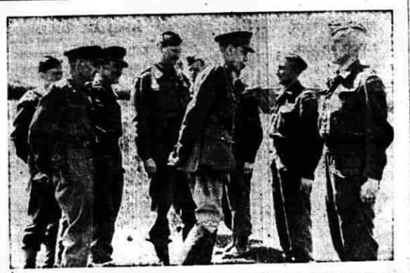 General Johnson, V.C, speaking to company officers during his inspection of Lancaster Home Guard. Behind the General is Lieut. Colonel Black, commanding officer.