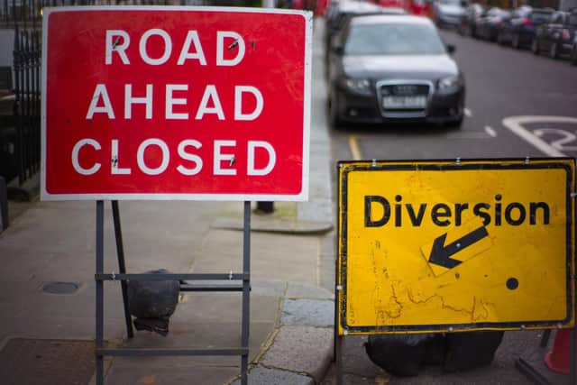 Police have closed a road in Carnforth due to a car crash.