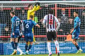Harry Burgoyne made a couple of fine saves in Morecambe's loss at Gillingham Picture: Morecambe FC