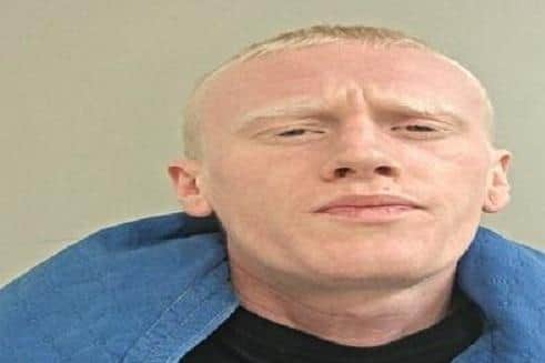 Alexander Sands is wanted for breaching the terms of his suspended prison sentence (Credit: Lancashire Police)
