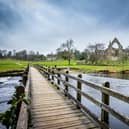 Bolton Abbey and the footbridge over the River Wharfe in the Yorkshire Dales National Park. PIC: Tony Johnson