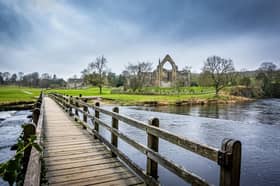 Bolton Abbey and the footbridge over the River Wharfe in the Yorkshire Dales National Park. PIC: Tony Johnson