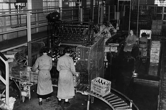 Workers packaging beer at Usher's Park Brewery, in Edinburgh, in 1958.