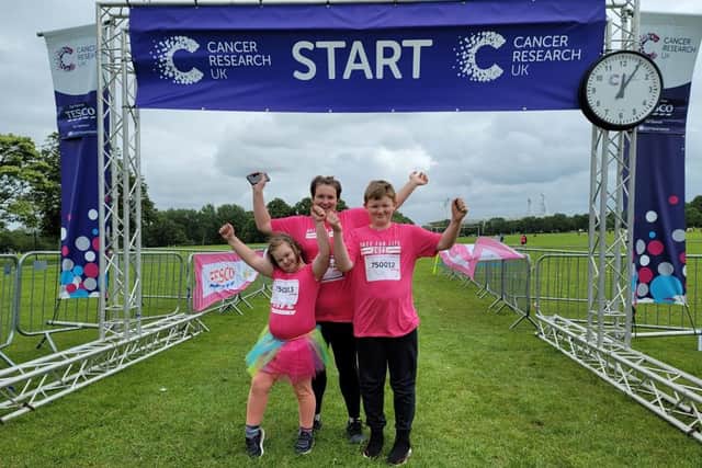 The Shaw family - mum Sarah with children Ryan, 10 and Amy, six getting ready for the Pretty Muddy Challenge