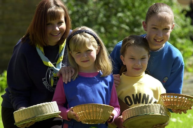 Ranger Michelle Martin, rainbow Megan Hodgkinson, brownie Chloe Horner and guide Sarah Allen collecting for Melanie's Magic Wand appeal in 2002 at a church service at St. Matthew's, Preston