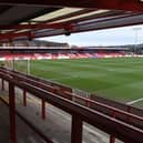 A football supporter who ran onto the pitch at Accrington Stanley has been banned from attending games for the next three years