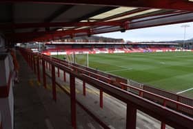 A football supporter who ran onto the pitch at Accrington Stanley has been banned from attending games for the next three years