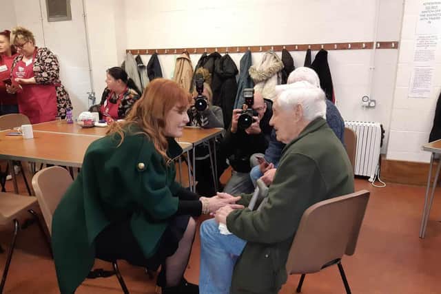The Duchess of York chats with 90-year-old Colin Schofield, who lost his wife Jean this year, at St Matthew's Church lunch club