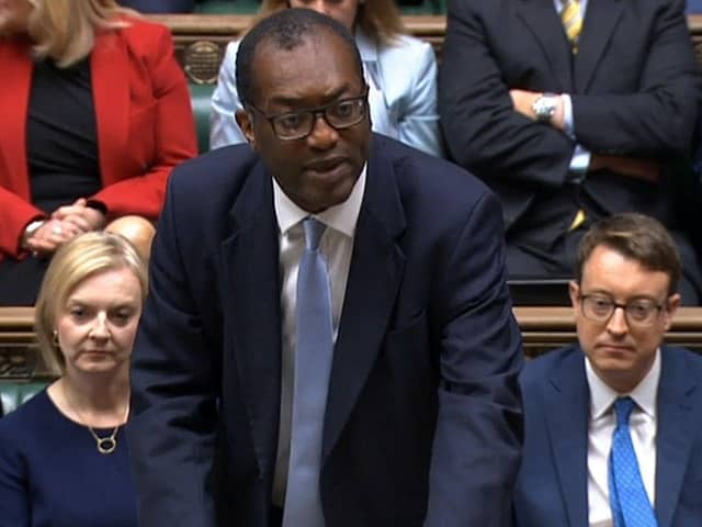 TOPSHOT - A video grab taken from footage broadcast by the UK Parliament's Parliamentary Recording Unit (PRU) shows Britain's Chancellor of the Exchequer Kwasi Kwarteng unveiling an anti-inflation budget plan at the House of Commons in London on September 23, 2022.
