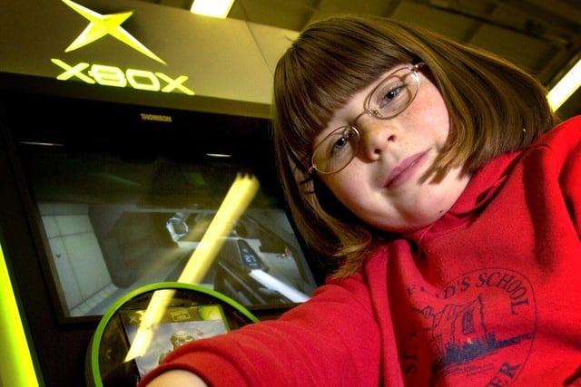 Seven-year-old Laura Farrier checks out the new Xbox games console at Toys R Us in Deepdale, Preston