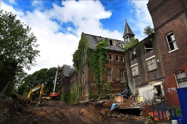 Demolition goes on at the former St Joseph's Orphanage after the blaze