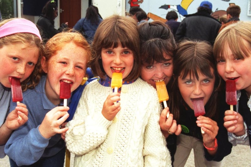 Children on playschemes at Bradford, Claire Wilkinson, Heather Lambert, Rebecca and Kirsty Devanny and Hayley Moult, cool down at Frontierland wild west theme park, Morecambe, with tourism officer Mary Lucas.