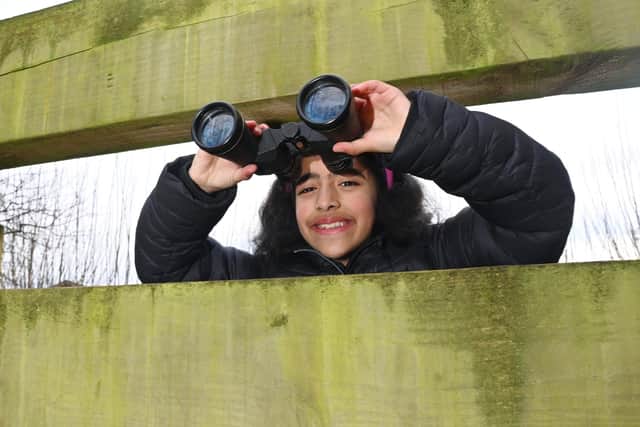Hafsa Ali, aged nine, is on the lookout for wildlife in the school's environmental space - and any threats to future crops