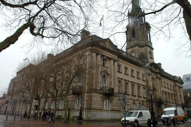 Sessions House: The obvious symmetry of the Sessions House in Preston can be seen in this image of the Grade II* listed building. When built the design involved a symmetrical main frontage of thirteen bays facing Harris Street. The central section featured a round-headed doorway with a balcony above; there was a round-headed window with elaborate detailing on the first floor and oculus on the second floor flanked by huge Ionic order columns which spanned the second and third floors. There was a four-stage tower above, which at 54.7 metres (179.5 ft) high, made the building one of the tallest buildings in Preston