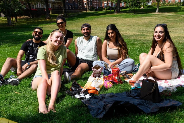 A group of friends enjoying the sun in Winckley Square