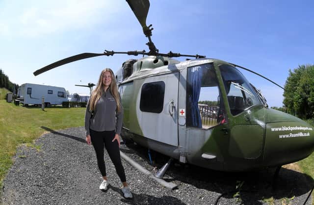 Katie Lewin at Ream Hills Holiday Park and the helicopter - one of the most unusual places to sleep in Lancashire