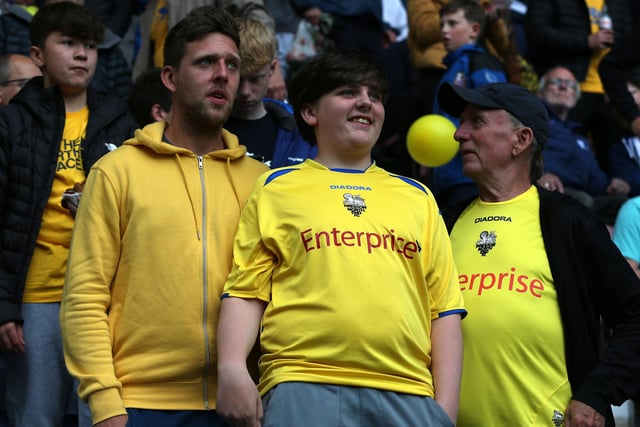 PNE fans in yellow to back their side.