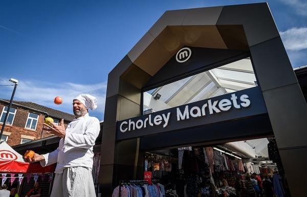 A street entertainer performs at Chorley Markets over the Easter weekend