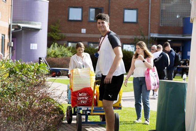 A UCLan volunteer helping a new student move in