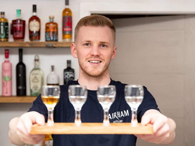 Co-owner Liam Stemson with a selection of tasting gins