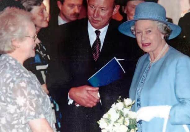 Margaret Mason meeting the Queen