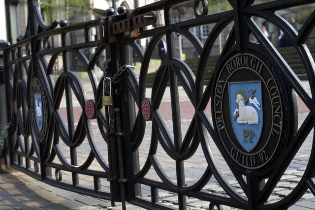 Gates blocking car access to Friargate in Preston - bearing the crest of the city and celebrating the Guild 92