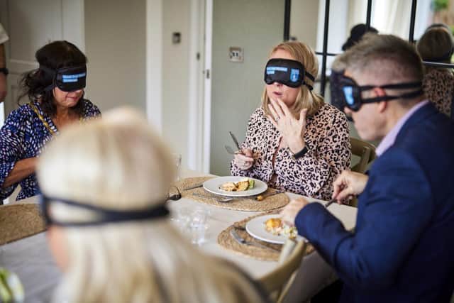 Guests taking part in the Dinner in the Dark event for the Guide Dogs. Photo: Barratt and David Wilson Homes