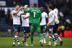 Preston North End's Ben Whiteman (left) and goalkeeper Freddie Woodman (centre) celebrate with their teammates following the full time whistle.