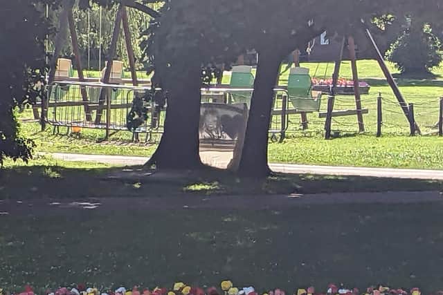 George Hinds memorial bench overlooks the swings in Happy Mount Park.