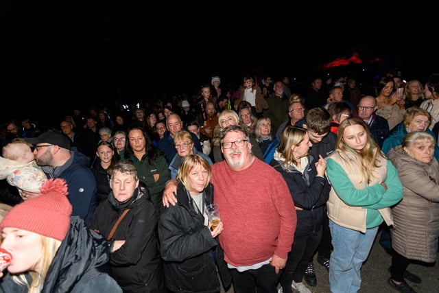 Crowds watch the performance as part of Astley Hall being illuminated