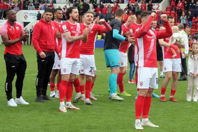 Morecambe celebrated survival on the final day of last season Picture: Michael Williamson