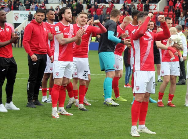 Morecambe celebrated survival on the final day of last season Picture: Michael Williamson
