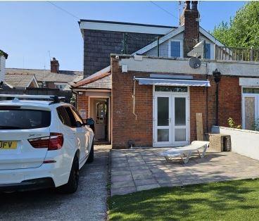 The owner of 5 Ash Grove wants permission to turn the semi-detached house into two self-contained flats with external alterations, a single storey side extension, and associated parking spaces.